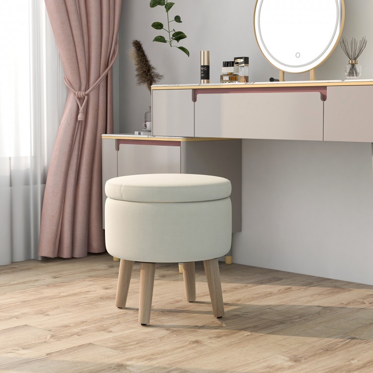 Round beige storage ottoman with rubber wood legs, featuring a flip-over lid for versatile use in living rooms or.