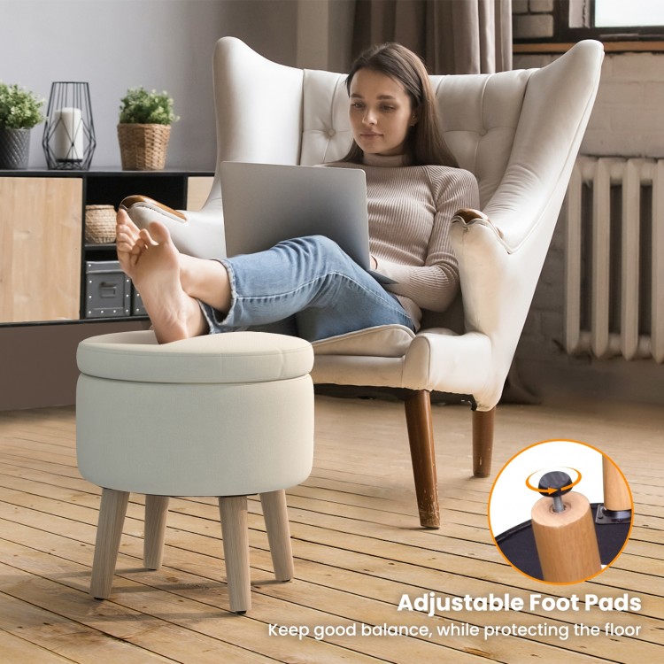Round storage ottoman in beige with rubber wood legs and adjustable foot pads, ideal for living room or bedroom use.