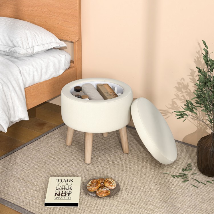 Beige round storage ottoman with rubber wood legs, featuring a flip-over lid for snacks and ample internal storage.