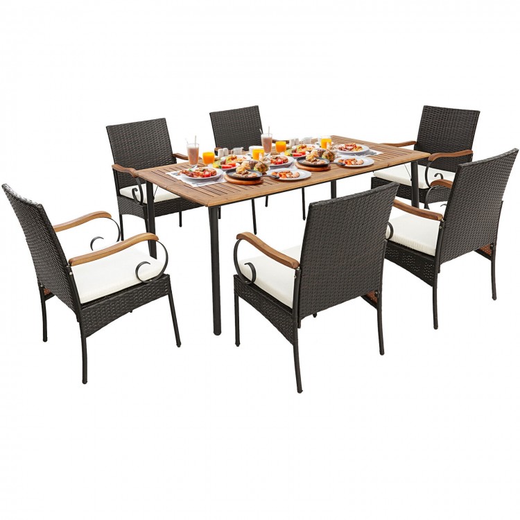 Elegant 7-piece patio dining set showcasing a spacious acacia wood tabletop, perfect for hosting meals outdoors.