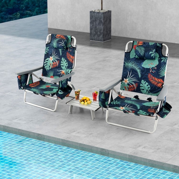 Two 5-position outdoor folding beach chairs with tropical print, paired with a side table, perfect for poolside.
