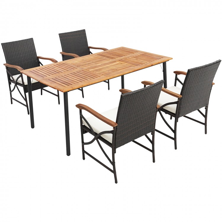 Outdoor dining set featuring an acacia wood table and four PE rattan chairs with cushions, perfect for patio gatherings.