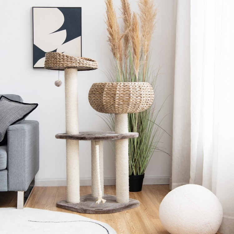 Rattan cat tree with napping perch, sisal posts, and soft cushions in beige, perfect for indoor cat play and relaxation.
