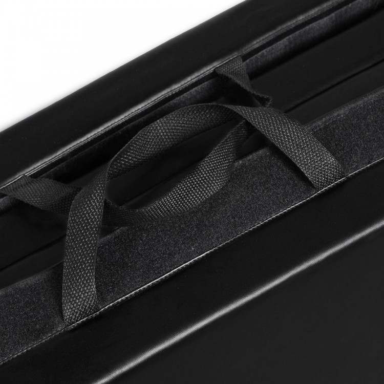 Close-up of the black folding gymnastics mat's hand carry belt, designed for easy transport and storage.