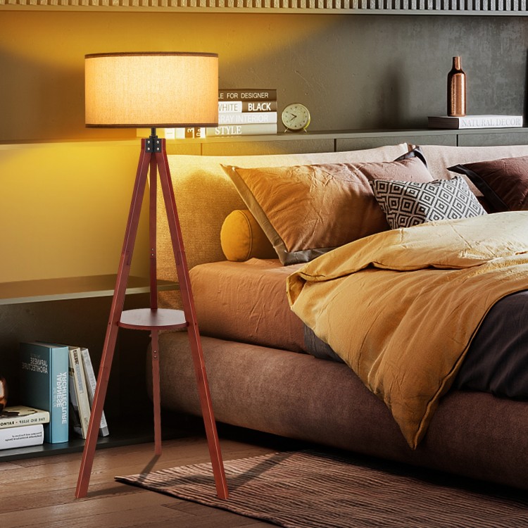Tripod floor lamp with a brown wooden base and flaxen lampshade, perfect for modern home decor and easy assembly.