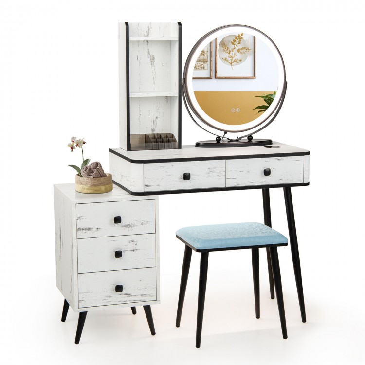 Vanity table set with lighted mirror, cushioned stool, and storage drawers, perfect for makeup or writing tasks.