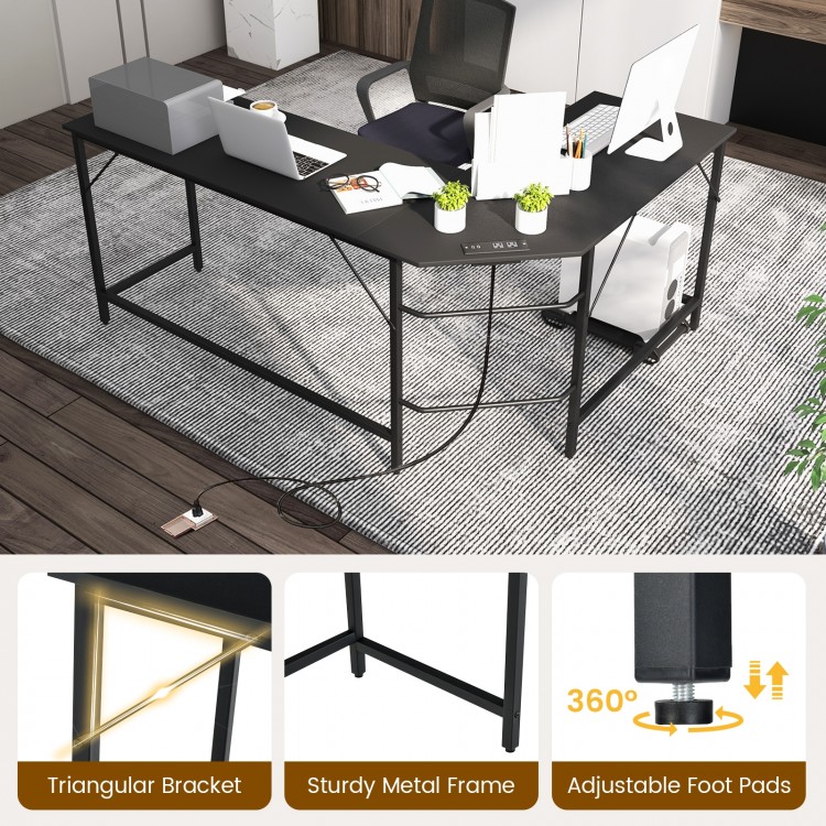 L-shaped black computer desk with power outlets, USB ports, and adjustable foot pads for home office use.