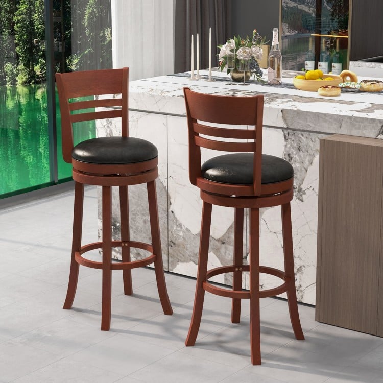 Set of 2 brown bar stools with PU upholstered seats, 360° swivel design, perfect for kitchen or pub use.