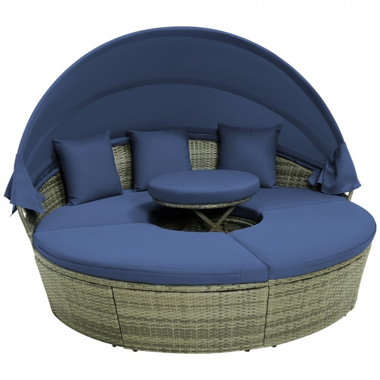 Outdoor PE wicker round daybed featuring a smooth-opening retractable canopy and removable navy cushion covers for easy.