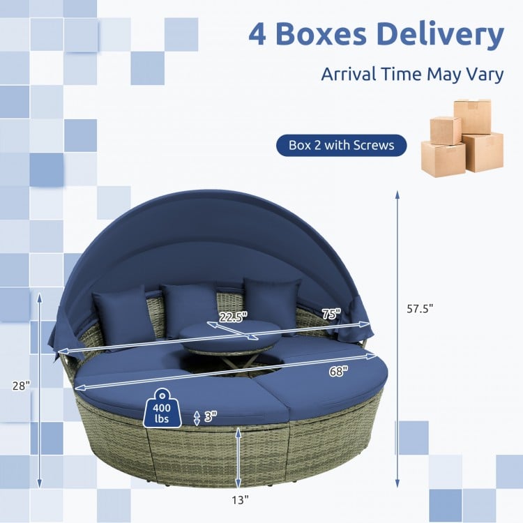 Outdoor PE wicker round daybed with retractable canopy and navy cushions, perfect for backyard relaxation.
