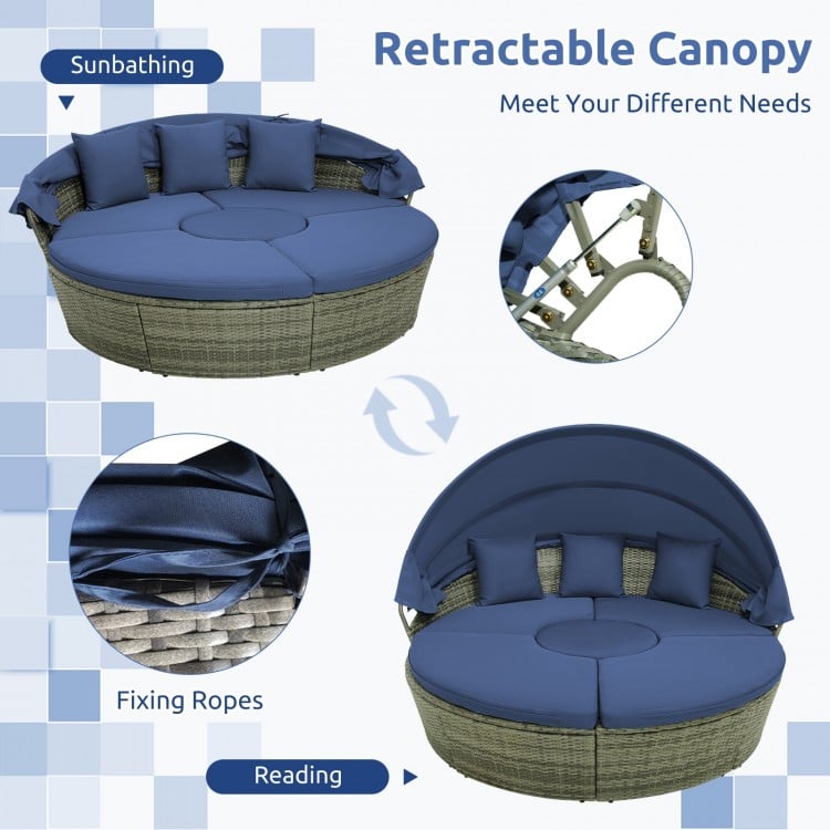 Outdoor PE wicker round daybed with retractable canopy and navy cushions, perfect for sunbathing or reading in the.