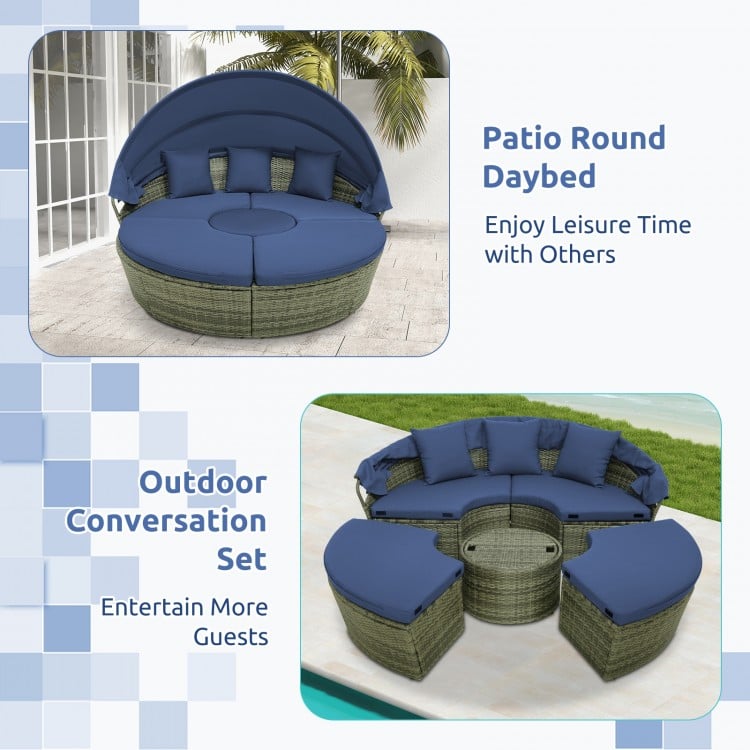 Round outdoor daybed with retractable canopy and navy cushions, perfect for backyard relaxation and entertaining guests.