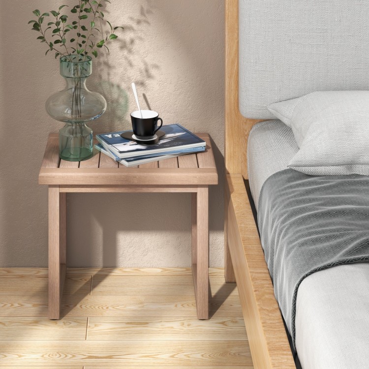 Natural teak wood bath spa stool with slat design, anti-slip foot pads, perfect for indoor or outdoor use.