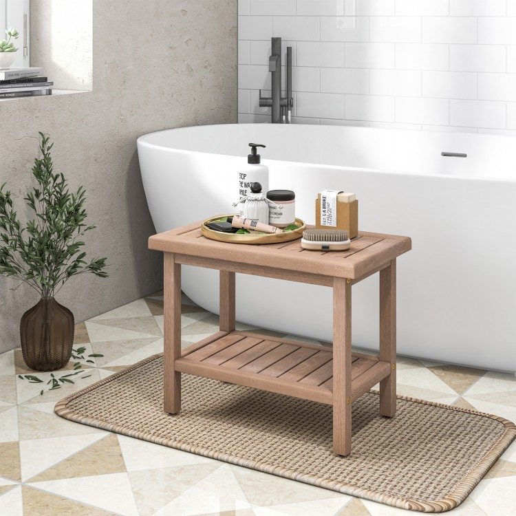Teak shower bench with 2-tier storage shelf, ventilated slat design, and non-slip feet, perfect for bathroom use.