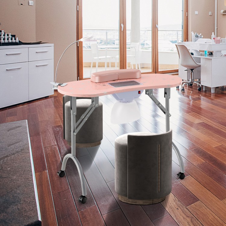 Manicure nail table in pink with a bendable LED lamp, built-in dust collector, and soft wrist pad for comfortable use.