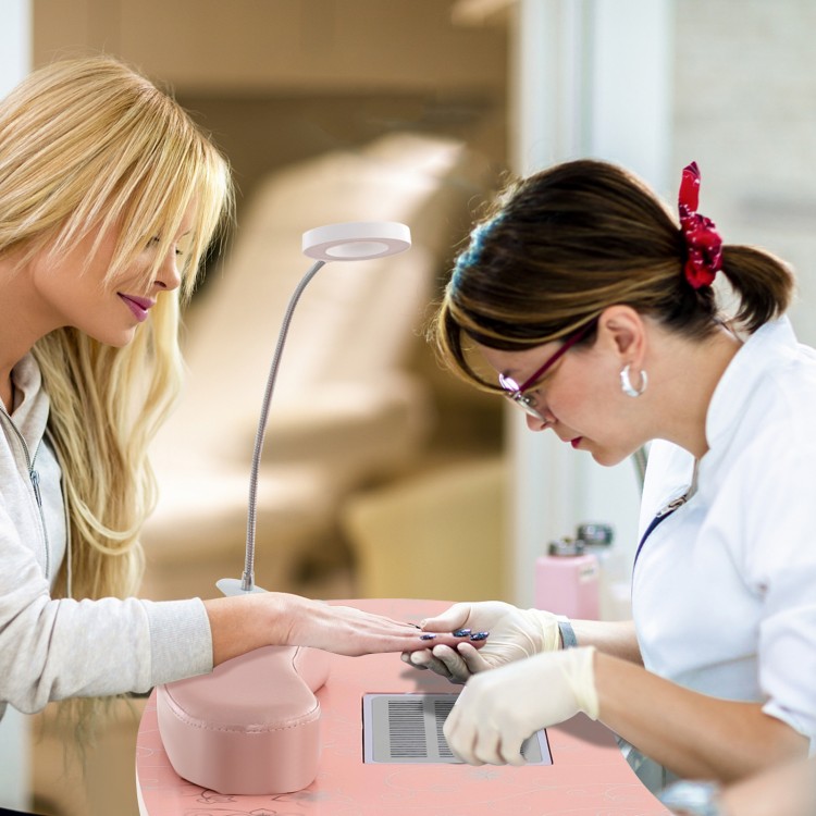 Manicure nail table in pink with built-in dust collector and bendable USB LED lamp for convenient nail care.