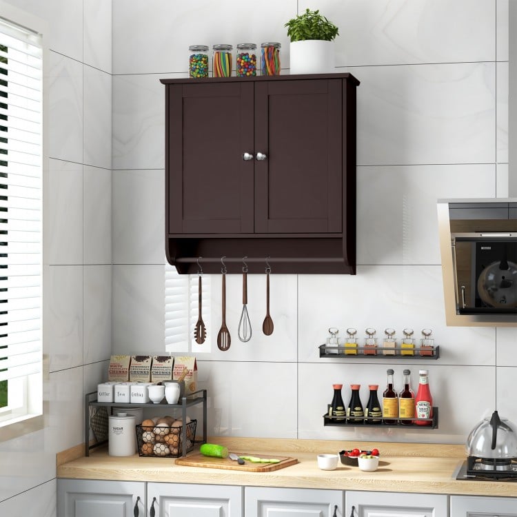Wall-mounted brown medicine cabinet with towel bar, featuring adjustable shelves for cosmetics and personal care.