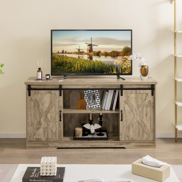 Farmhouse entertainment center in gray with sliding barn doors, adjustable shelves, and spacious top for TV placement.
