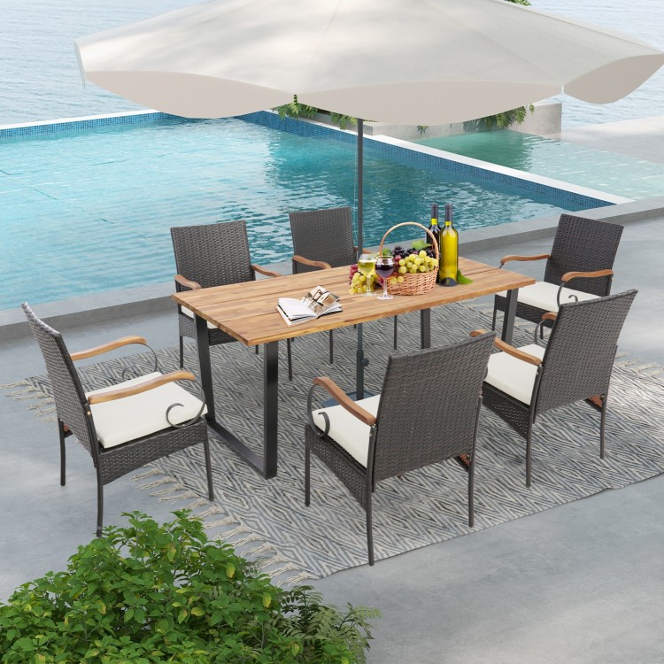 7-piece patio rattan dining set with acacia wood tabletop and ergonomic cushions, perfect for backyard or poolside.