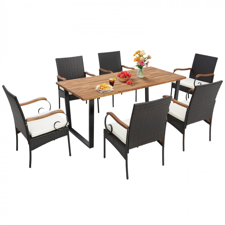 7-piece patio rattan dining set with acacia wood tabletop and ergonomic chairs, perfect for backyard gatherings.