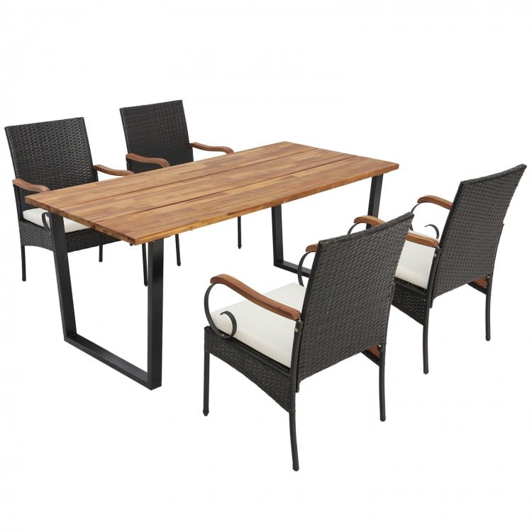 Dining set featuring four ergonomic chairs with elastic cushions and a stylish acacia wood tabletop, perfect for.