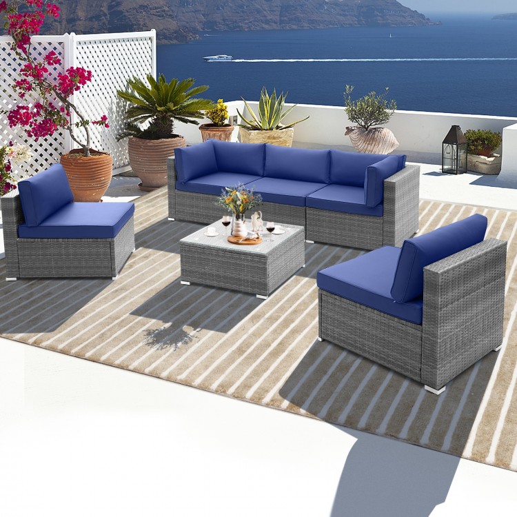 L-shaped 6 piece patio conversation sofa set with navy cushions and tempered glass coffee table for outdoor relaxation.
