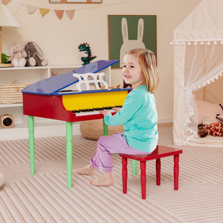 Colorful 30-key wood toy grand piano with bench, designed for kids aged 3-8, promoting creativity and coordination.