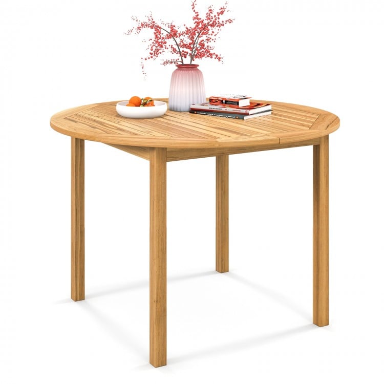 Round outdoor dining table made of acacia wood, spacious for 4 persons, perfect for yard or garden use.