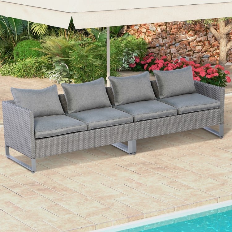 Gray patio sofa set with cushions, featuring colorfast PE wicker and sturdy metal frame, ideal for outdoor relaxation.