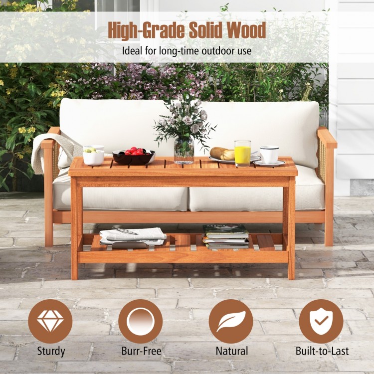 2-tier patio coffee table made of solid wood with slatted tabletop and bottom shelf, ideal for outdoor use.