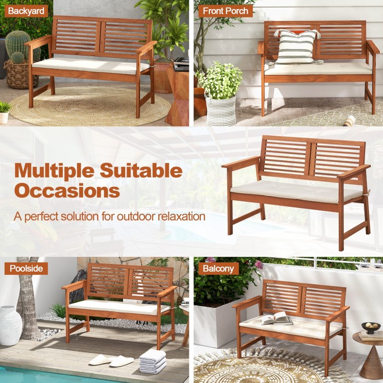 2-person solid wood patio bench with backrest and cushions, perfect for outdoor relaxation on the balcony or poolside.