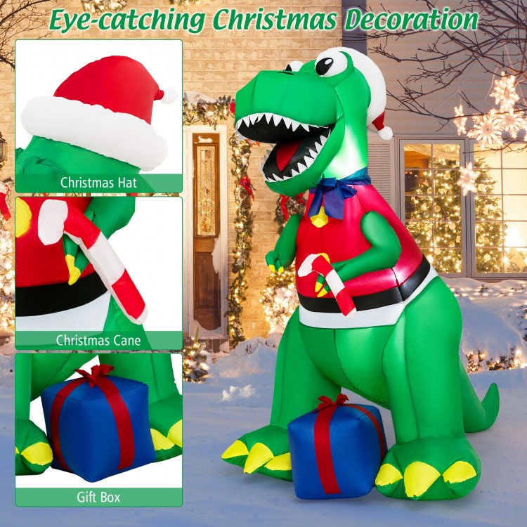 6FT inflatable dinosaur Christmas decoration with LED lights, hat, cane, and gift box for festive outdoor displays.