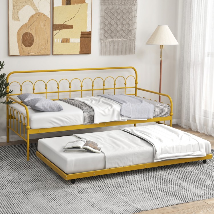 Twin size golden metal daybed with trundle and lockable wheels, ideal for guest rooms and maximizing space.