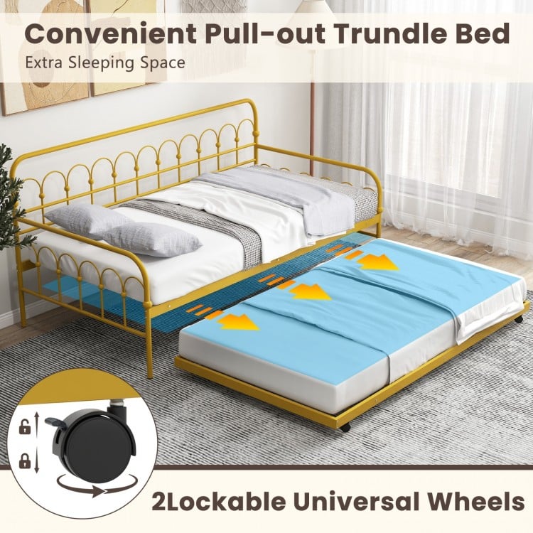 Twin size golden metal daybed with pull-out trundle and lockable wheels, ideal for guest accommodation and space-saving.