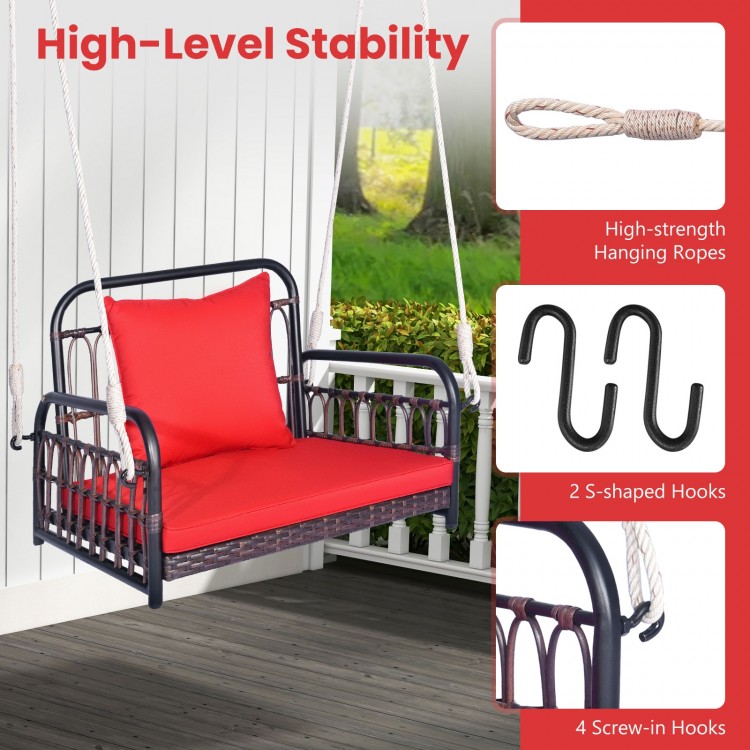 Patio rattan porch swing hammock chair with red seat cushion, featuring a stable metal frame and sturdy hanging ropes.