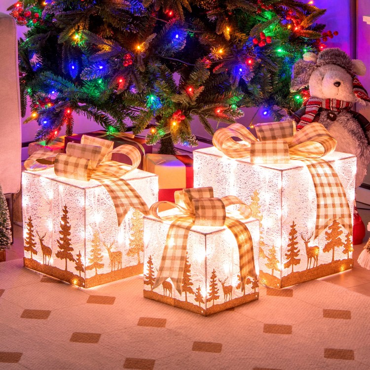 Set of 3 lighted Christmas gift boxes with warm white lights, featuring a charming silhouette pattern for festive decor.