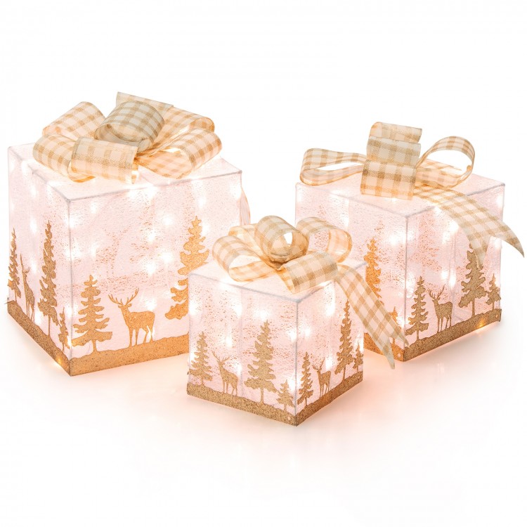 Close-up of a lighted Christmas gift box with warm white lights, showcasing sparkling fabric and a lovely bow for.