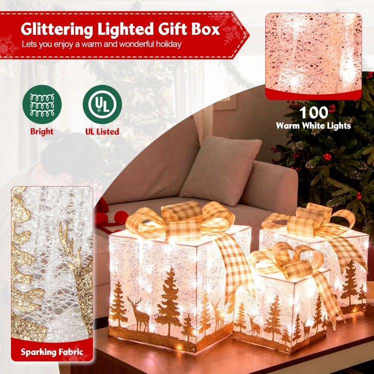 Set of 3 lighted Christmas gift boxes with 100 warm white lights, featuring sparkling fabric and a charming silhouette.