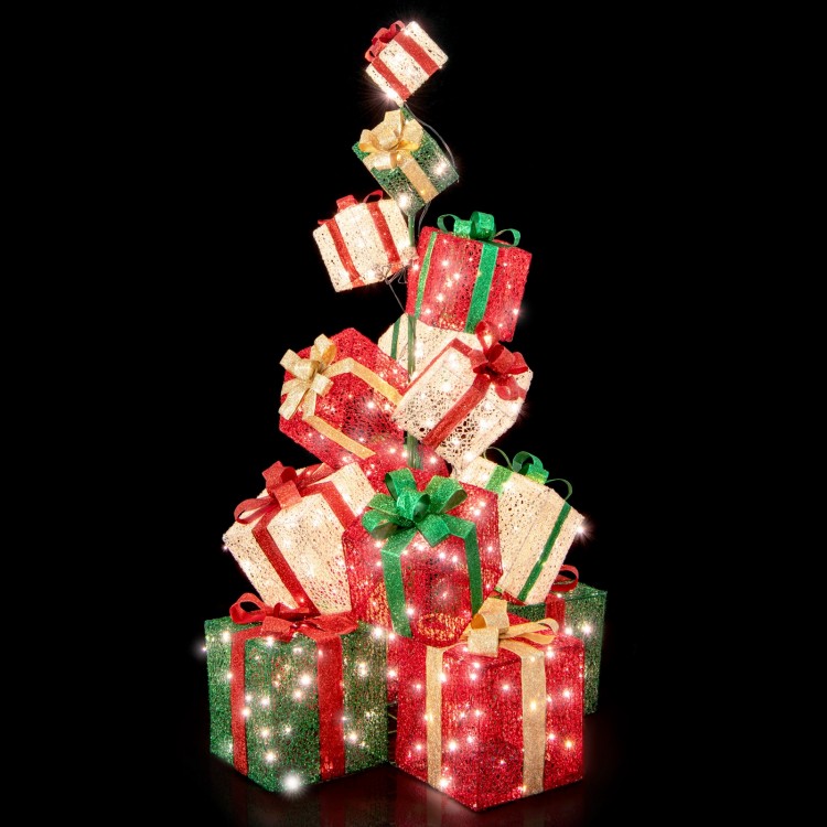 Stacked lighted Christmas gift box tower with 15 boxes, 450 warm white lights, and vibrant bows for festive decor.