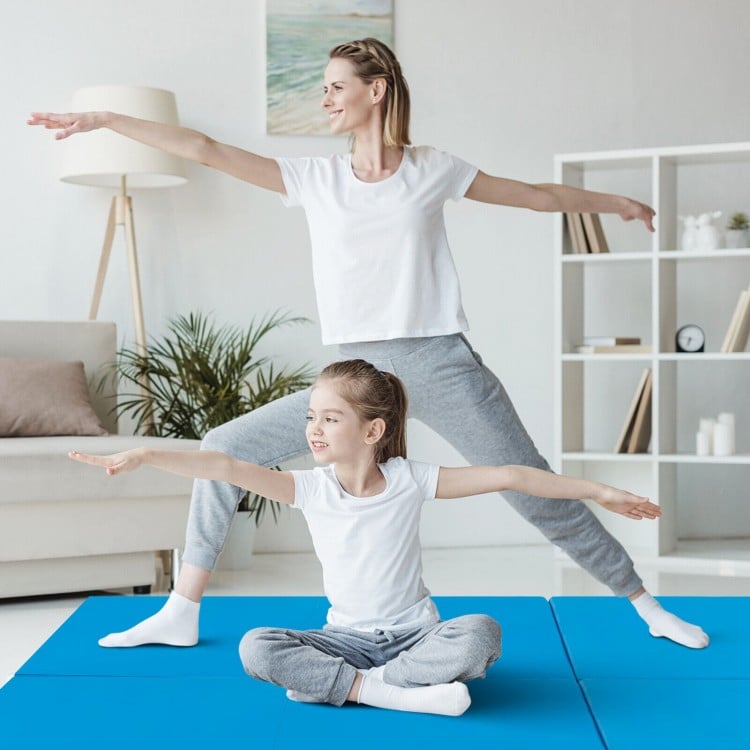 Two people practicing yoga on a blue 6 x 2 FT tri-fold gym mat, featuring a waterproof PU leather cover.