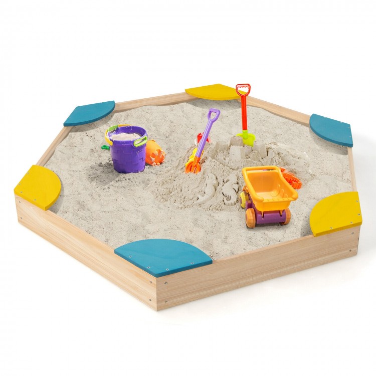 Hexagonal outdoor solid wood sandbox with built-in seats, featuring sand and colorful toys for kids aged 3+.