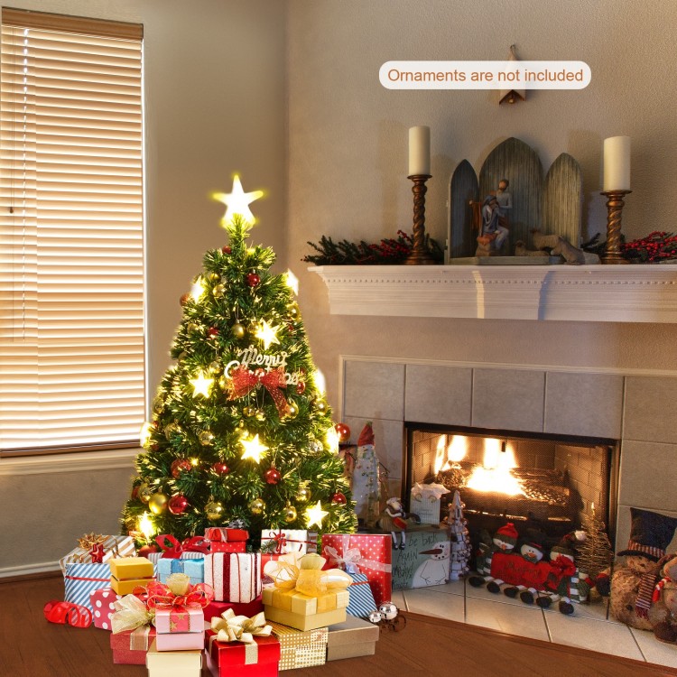 Prelit 4 ft fiber optic Christmas tree with warm white lights, featuring a metal base and surrounded by festive gifts.