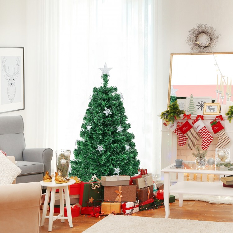 Prelit 4 ft fiber optic Christmas tree with warm white lights, decorated with stars and surrounded by festive gifts.