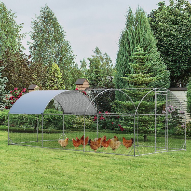 Large metal chicken coop with galvanized dome cage and waterproof cover, ideal for outdoor use in your backyard.