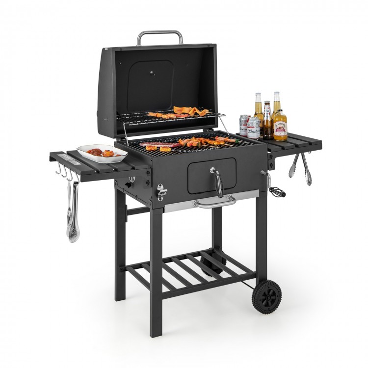 Outdoor BBQ charcoal grill with two foldable side tables, wheels, and a large cooking area for easy outdoor grilling.