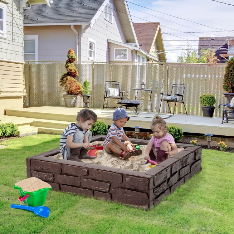Kids playing in a brown 2-in-1 HDPE sandbox with cover, ideal for outdoor fun and creativity for ages 3-12.