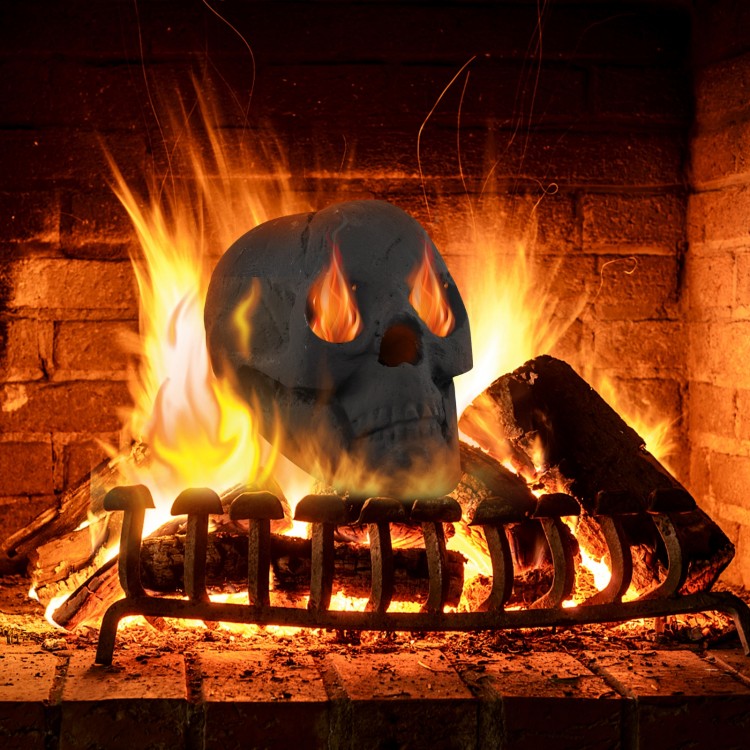 Realistic black skull decoration with flames in eyes, made of fireproof ceramic fibre, perfect for Halloween ambiance.