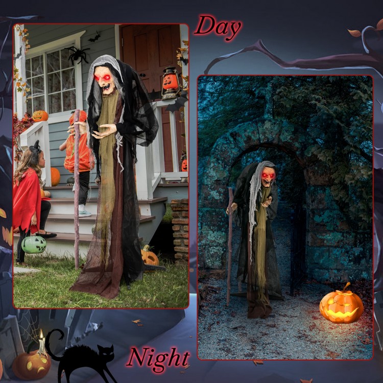 Life-size animatronic witch with red eyes and posable arms, perfect for Halloween decor in indoor or outdoor settings.