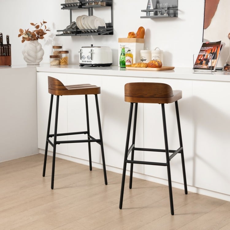 Industrial bar stools with low back and footrests, 29" seat height, perfect for kitchen islands or dining bars.