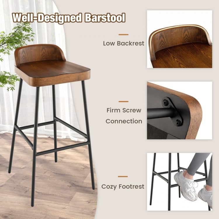 Industrial bar stool with low backrest and footrest, 29" height, sturdy metal frame for kitchen island or dining bar.